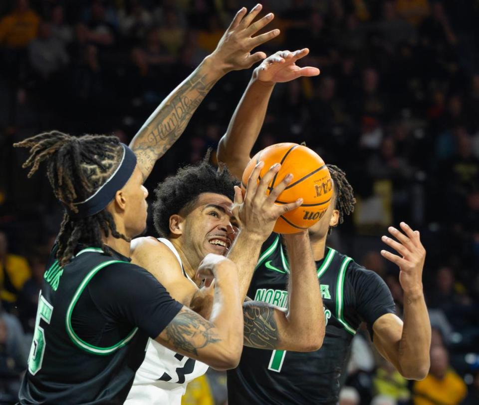 Wichita State’s Ronnie DeGray III struggles to find room to the basket between North Texas defenders 	
Rubin Jones, left, and Aaron Scott during the first half of their game at Koch Arena on Thursday night. 