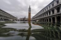 FILE - In this Friday, Nov. 15, 2019 file photo, a view of flooded St. Mark's Square in Venice, Italy. Lashing winds that pushed 1.87 meters (nearly 6 feet 2 inches) of water into Venice in November 2019 and ripped the lead tiles off St. Mark’s Basilica for the first time ever shocked Venetians with the city’s second-worst flood in history, but it was the additional four exceptional floods over the next six weeks that triggered fears about the impact of worsening climate change. (AP Photo/Luca Bruno, File)