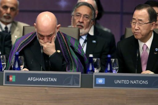 Afghan President Hamid Karzai (L) and UN Secretary General Ban Ki-moon attend a meeting at the NATO summit in Chicago, Illinois. Karzai sought to reassure nervous allies that the sacrifices made on all sides would not have been vain, maintaining Taliban Islamic militants could not recapture power