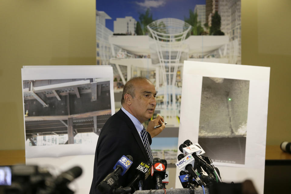 Mark Zabaneh, Executive Director of the Transbay Joint Powers Authority, points to a photograph showing a a cracked steel beam found in the Salesforce Transit Center, during a news conference Wednesday, Sept. 26, 2018, in San Francisco. A second beam in San Francisco's celebrated new $2 billion transit terminal shows signs of cracking, an official said Wednesday, a day after a crack in a nearby support beam shut down the building that opened just last month. (AP Photo/Eric Risberg)