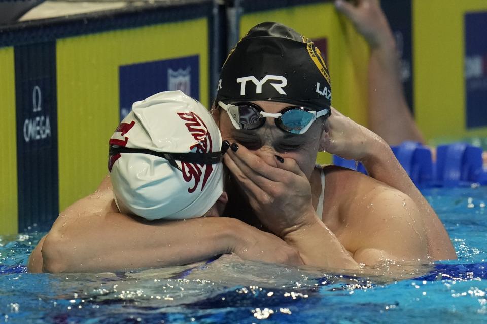 Annie Lazor and Lilly King react after the women's 200 breaststroke during wave 2 of the U.S. Olympic Swim Trials on Friday, June 18, 2021, in Omaha, Neb. (AP Photo/Jeff Roberson)