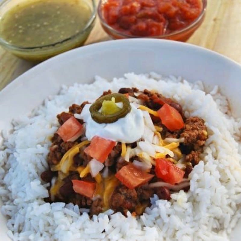 <p>Krista Marshall</p><p>Make a big batch of flavored meat, steam some rice, set out a variety of toppings and you've got yourself a party.</p><p><strong>Get the recipe: <a href="https://parade.com/930077/kristamarshall/burrito-bowl-slowcooker-recipe/" rel="nofollow noopener" target="_blank" data-ylk="slk:Crock Pot Smothered Burrito Bowls;elm:context_link;itc:0;sec:content-canvas" class="link rapid-noclick-resp">Crock Pot Smothered Burrito Bowls</a></strong></p>