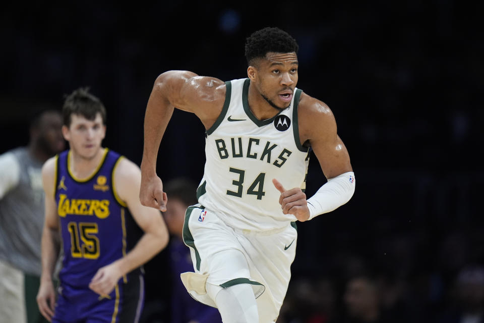 Milwaukee Bucks forward Giannis Antetokounmpo (34) makes his way downcourt after making a basket during the first half of an NBA basketball game against the Los Angeles Lakers, Friday, March 8, 2024, in Los Angeles. (AP Photo/Jae C. Hong)