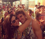 Celebrity PDA overload: Before they split, Kelly Brook tweeted this photo of herself with her boyfriend Thom Evans having a big hug during a music festival. Copyright [Kelly Brook]