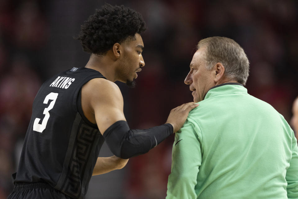 Michigan State's Jaden Akins (3) talks with head coach Tom Izzo, right, during a break in play against Nebraska during the first half of an NCAA college basketball game Sunday, Dec. 10, 2023, in Lincoln, Neb. (AP Photo/Rebecca S. Gratz)