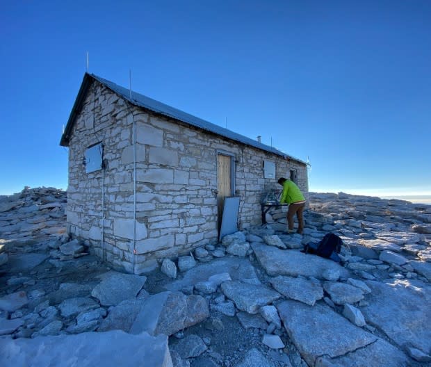 Summit signing. Adding your name to the ledger at the iconic Mount Whitney Hut is a rite of passage on the highest point of California's Sierras. <p>Chuck Graham</p>