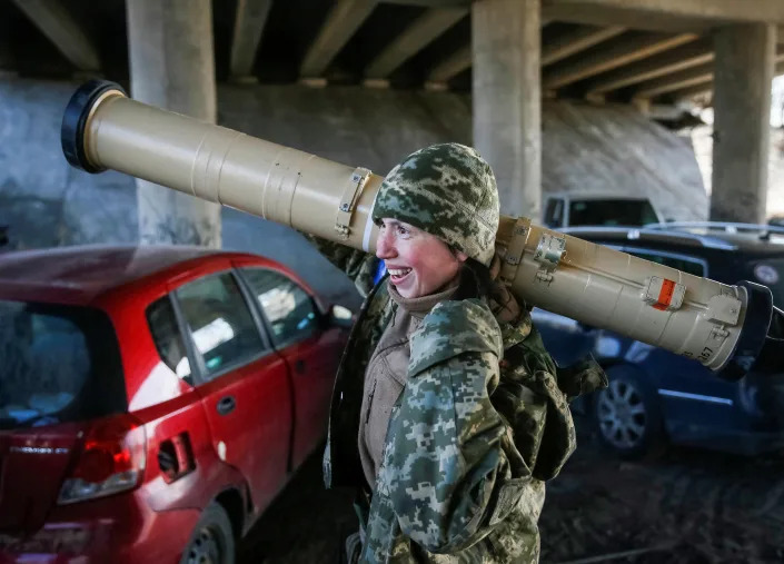 Tetiana Chornovol, former member of the Ukrainian Parliament, service member and operator of an anti-tank guided missile weapon system, carries an anti-tank missile at a position on the front line, amid Russia&#39;s invasion of Ukraine, in the Kyiv region, Ukraine March 20, 2022. REUTERS/Gleb Garanich