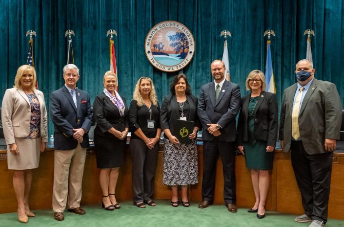 From left: Commissioner Michelle Stone; Commissioner Craig Curry; Angela Vick, Citrus County clerk of court and comptroller; Tina Novinger, controller, Marion County Clerk of Court and Comptroller; Jennifer Cole, finance director, Marion County Clerk of Court and Comptroller; Gregory C. Harrell, Marion County clerk of court and comptroller; Commissioner Kathy Bryant; and Commissioner Carl Zalak III. The Marion County Clerk of Court and Comptroller&#39;s Office was recently honored for excellence in financial reporting.