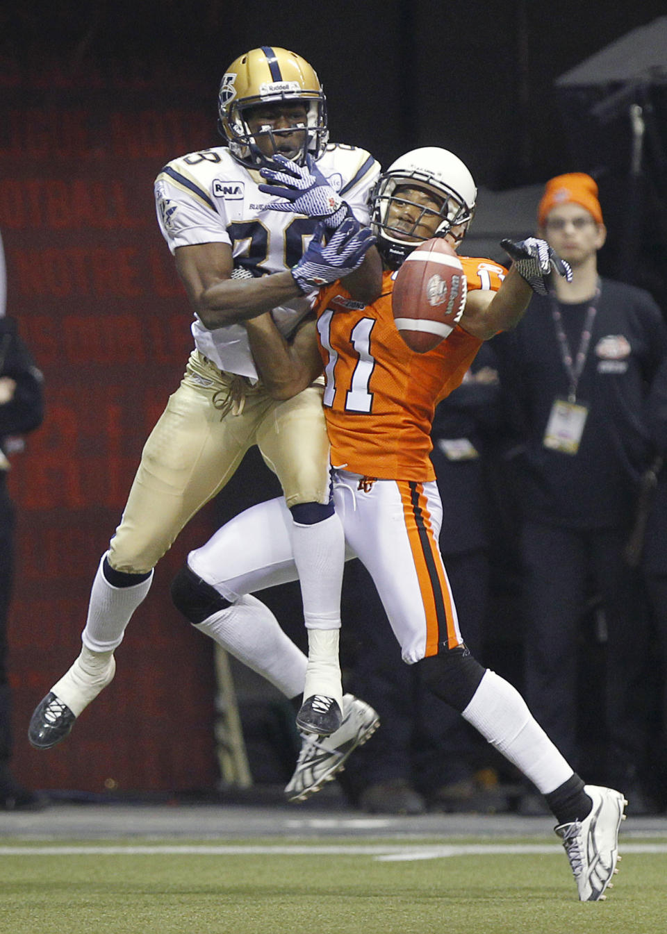 VANCOUVER, CANADA - NOVEMBER 27: Tad Kornegay #11 of the BC Lions knocks the ball away from Clarence Denmark #89 of the Winnipeg Blue Bombers in the end zone during the CFL 99th Grey Cup November 27, 2011 at BC Place in Vancouver, British Columbia, Canada. (Photo by Jeff Vinnick/Getty Images)