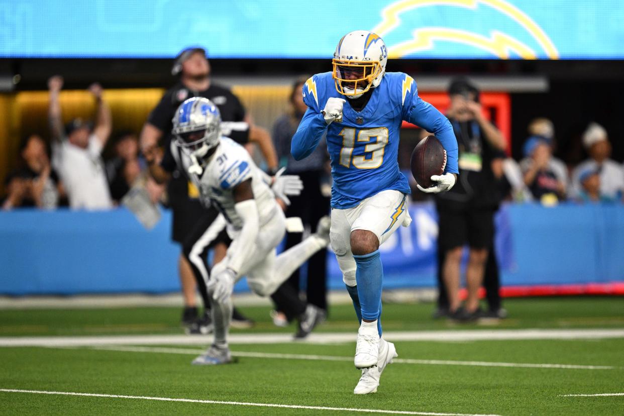 Los Angeles Chargers wide receiver Keenan Allen runs the ball for a touchdown after a catch against the Detroit Lions during the second half at SoFi Stadium on November 12, 2023 in Inglewood, California.