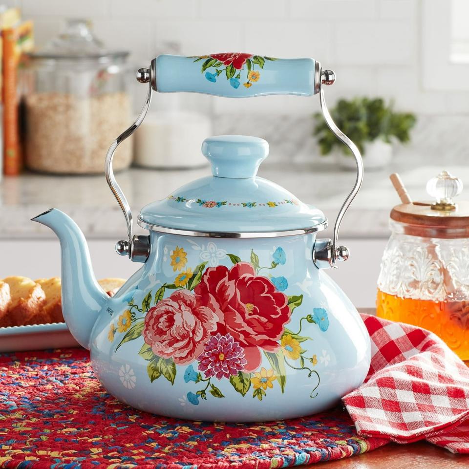 <p><a href="https://go.redirectingat.com?id=74968X1596630&url=https%3A%2F%2Fwww.walmart.com%2Fip%2FThe-Pioneer-Woman-Sweet-Rose-2-Quart-Enamel-on-Steel-Tea-Kettle%2F681440954&sref=https%3A%2F%2Fwww.thepioneerwoman.com%2Fproducts%2Fa60671553%2Fthe-pioneer-woman-watering-can-planter-walmart%2F" rel="nofollow noopener" target="_blank" data-ylk="slk:Shop Now;elm:context_link;itc:0;sec:content-canvas" class="link ">Shop Now</a></p><p>The Pioneer Woman Sweet Rose 2-Quart Tea Kettle</p><p>walmart.com</p><p>$15.97</p>