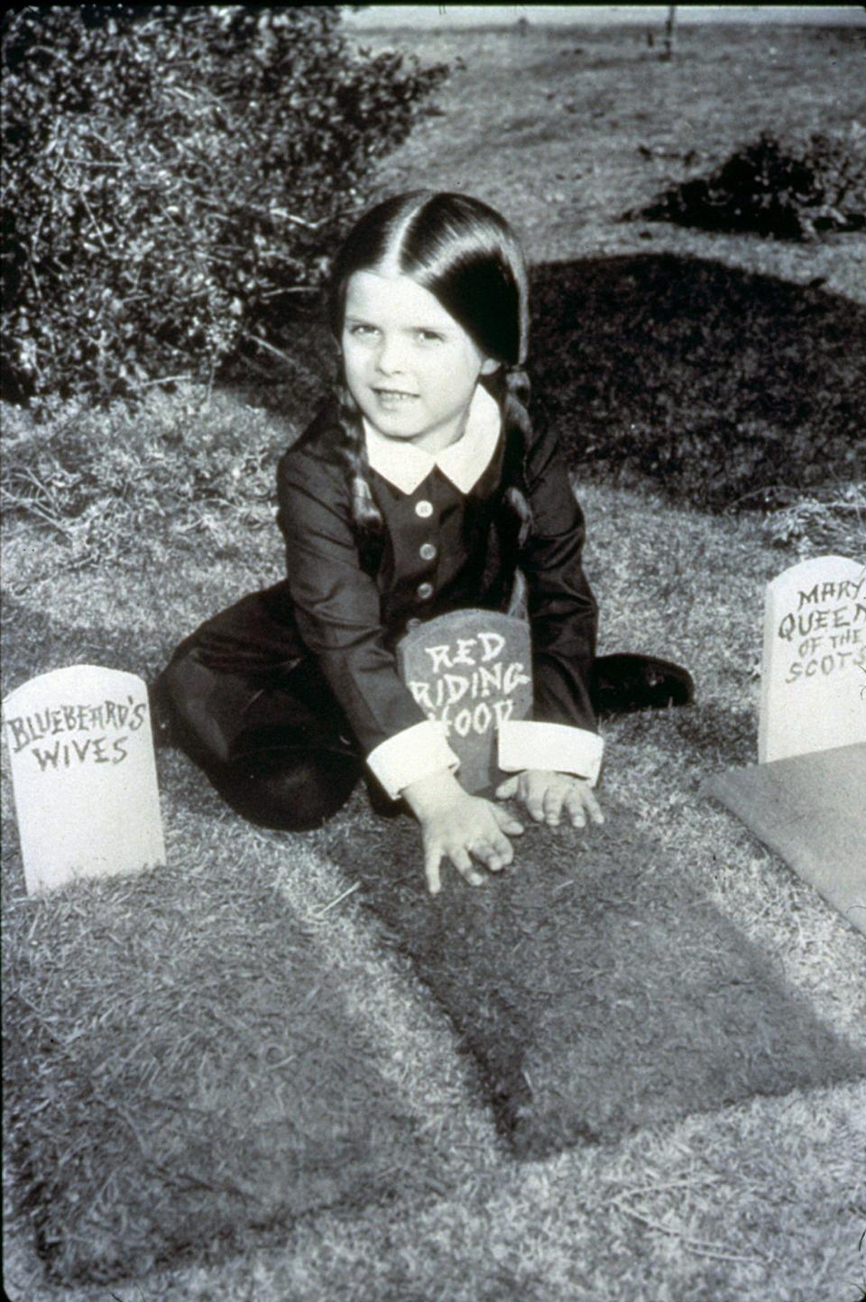 -Lisa Loring, in "The Addams Family" Wednesday Addams plays in the backyard of her home on 000 Cemeterey Ridge. Wednesday is just one off the many unusual family members in the "The Addams Family."