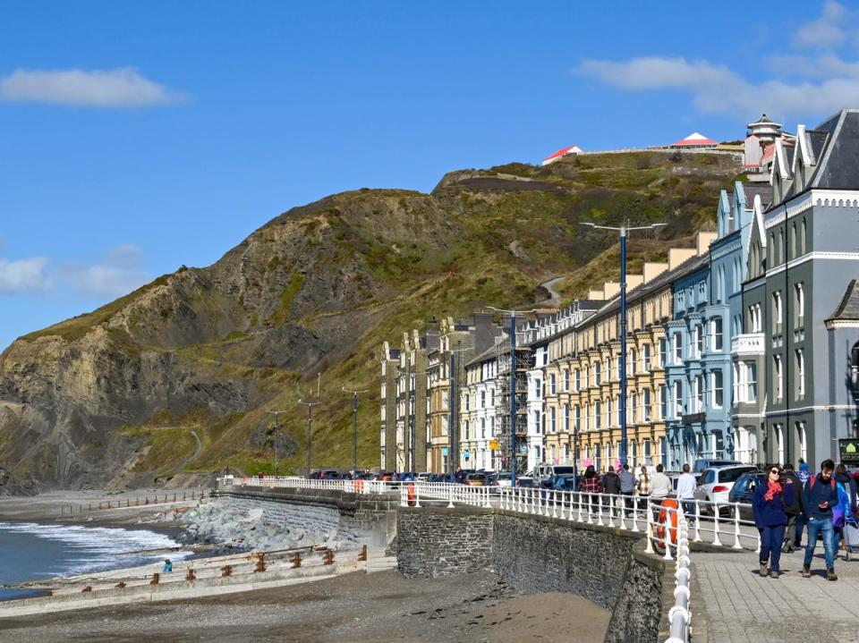 Row of traditional terraced houses on the seafront of Aberystwyth, Wales (Getty Images)