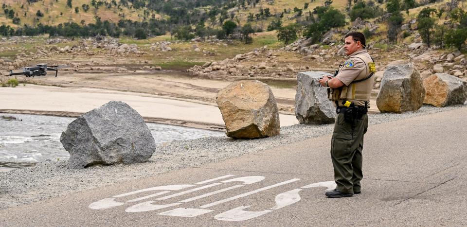 Tulare County Sheriffs Department deputy Adam Muller flies a drone along about 2000 feet of the Near Slick Rock Recreation Area above Lake Kaweah on Monday, May 1, 2023. The search continues for a man last seen Friday when another man and a child were rescued from the river.