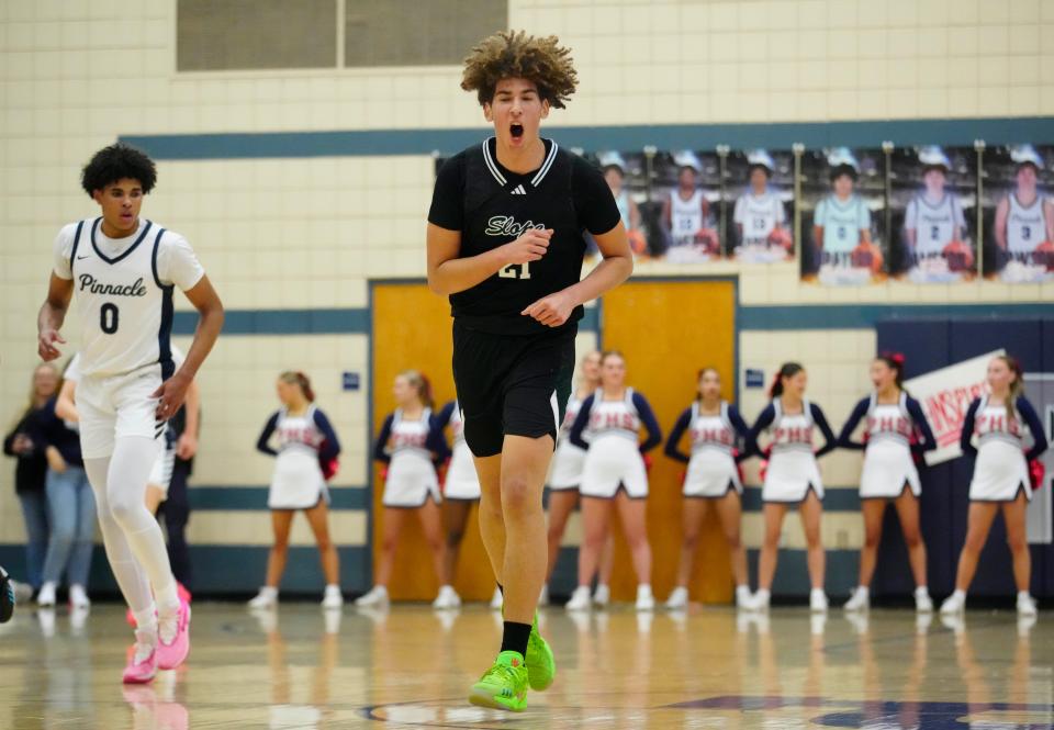 Sunnyslope center Darius Wabbington (21) yells after hitting a three-pointer against Pinnacle during a game at Pinnacle High School in Phoenix on Jan. 12, 2024.