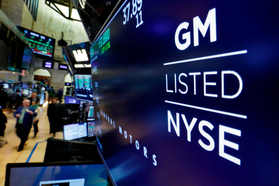 FILE- In this April 23, 2018, file photo, the logo for General Motors appears above a trading post on the floor of the New York Stock Exchange. General Motors Co.,reports their earnings on Tuesday, Jan. 30, 2024. (AP Photo/Richard Drew, File)