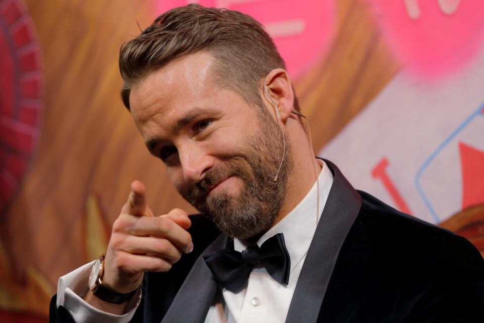 Actor Ryan Reynolds points into the crowd during ceremonies to honor him as Hasty Pudding Theatricals Man of the Year at Harvard University in Cambridge, Massachusetts, U.S. February 3, 2017.   REUTERS/Brian Snyder