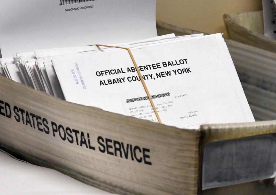 Absentee ballots wait to be counted at the Albany County Board of Elections in Albany, N.Y., on June 30, 2020.