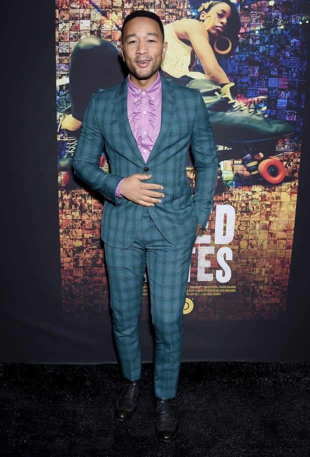 <p>John Legend in a Paul Smith suit and Prada shirt at the Los Angeles premiere of HBO's "United Skates."</p>