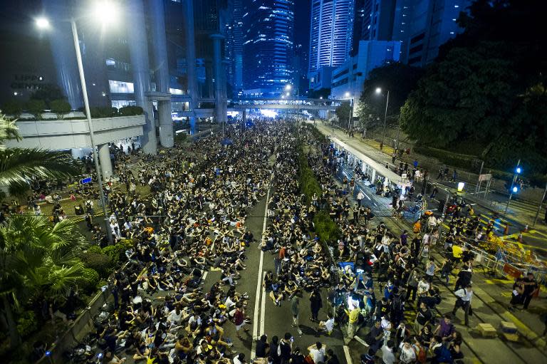 Pro-democracy demonstrators attend a protest in the Admiralty district of Hong Kong on October 1, 2014