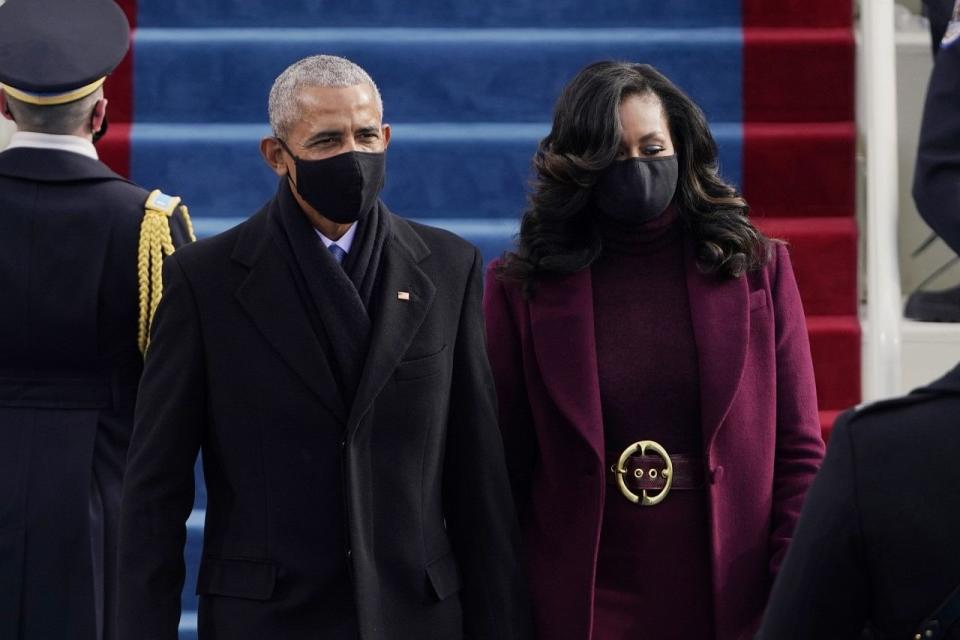 Former President Barack Obama and his wife Michelle arrive for the 59th Presidential Inauguration at the US Capitol for President-elect Joe Biden in Washington .