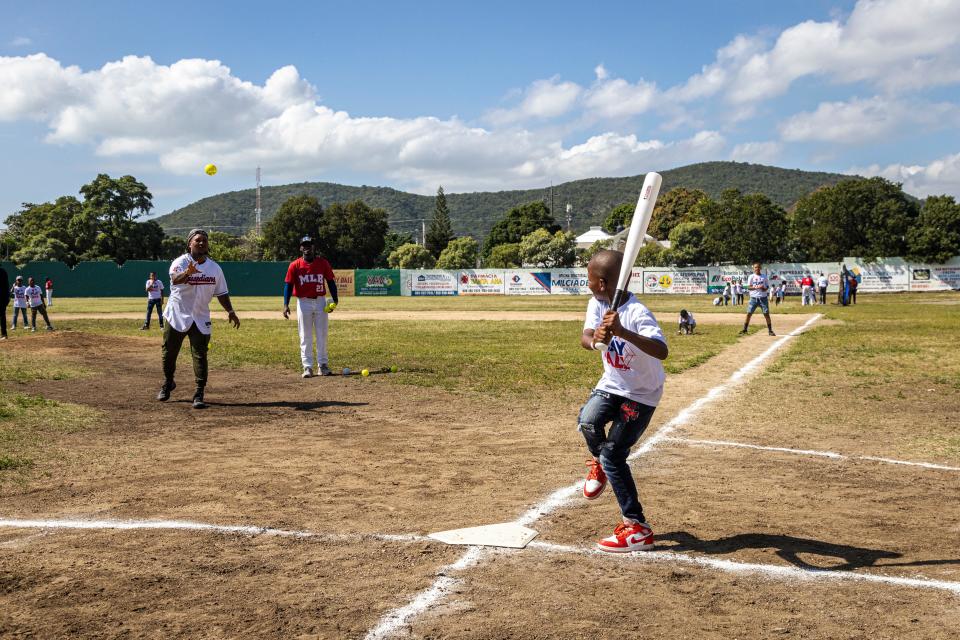 Jose Ramirez tosses a pitch during a Guardians community trip in the Dominican Republic.