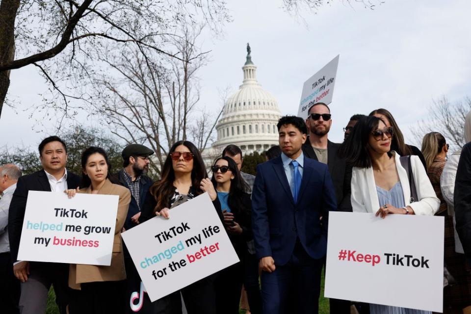 Participants hold signs in support of TikTok outside the U.S. Capitol Building on March 13, 2024 in Washington, DC.