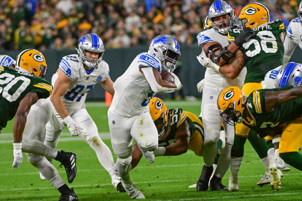 Sep 28, 2023; Green Bay, Wisconsin, USA; Detroit Lions running back <a class="link " href="https://sports.yahoo.com/nfl/players/31905" data-i13n="sec:content-canvas;subsec:anchor_text;elm:context_link" data-ylk="slk:David Montgomery;sec:content-canvas;subsec:anchor_text;elm:context_link;itc:0">David Montgomery</a> (5) rushes for a first down in the second quarter against the Green Bay Packers at Lambeau Field. Mandatory Credit: Benny Sieu-USA TODAY Sports