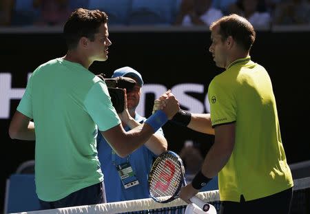 Tennis - Australian Open - Melbourne Park, Melbourne, Australia - 19/1/17 Canada's Milos Raonic shakes hands after winning his Men's singles second round match against Luxembourg's Gilles Muller. REUTERS/Issei Kato