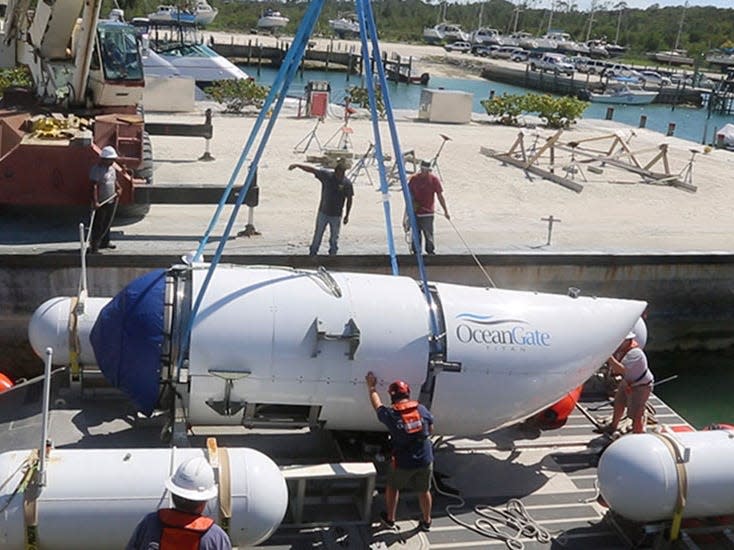 The Titan being lowered onto the platform in a harbour.