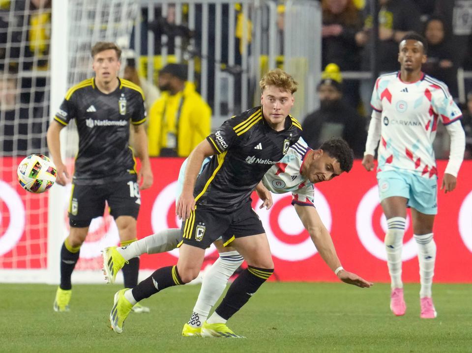 March 9, 2024; Columbus, Ohio, USA; 
Columbus Crew midfielder Aidan Morris (8) and Chicago Fire defender Allan Arigoni (27) during the second half of a soccer match Saturday at Lower.com Field. The Columbus Crew beat the Chicago Fire 2-1.