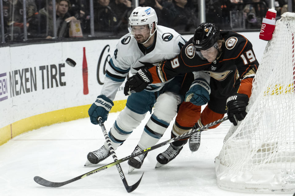 San Jose Sharks defenseman Marc-Edouard Vlasic (44) and Anaheim Ducks right wing Troy Terry (19) vie for the puck during the first period of an NHL hockey game in Anaheim, Calif., Friday, Jan. 6, 2023. (AP Photo/Kyusung Gong)