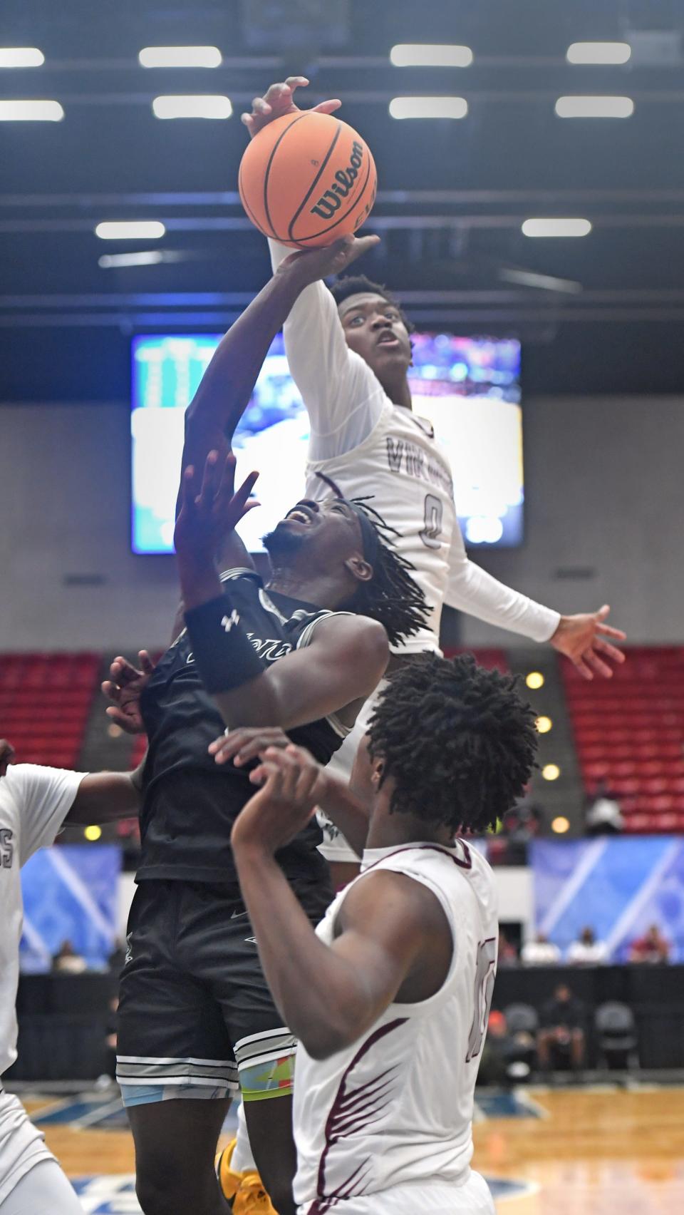 Mariner's Justin Lewis (5) has his shot blocked by Norland's Caleb Clarke (0) in the Class 5A semifinal during the Florida High School State Championships at the RP Funding Center in Lakeland on Wednesday March 6, 2024. Norland defeated Mariner 53-37.