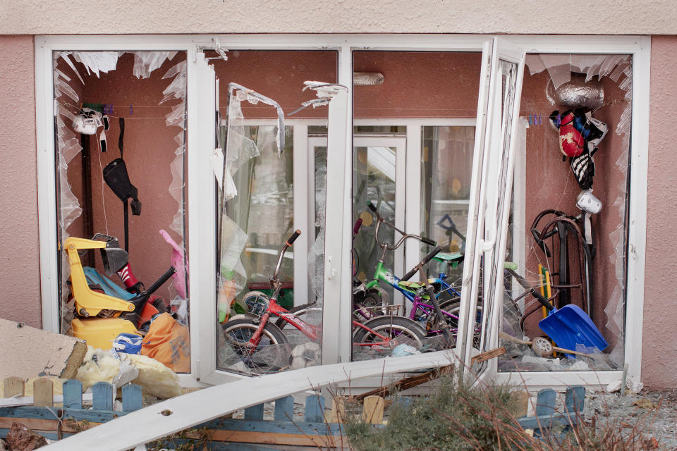 Children’s toys and bicycles lie inside a damaged apartment building in Bucha on April 3<span class="copyright">Natalie Keyssar</span>