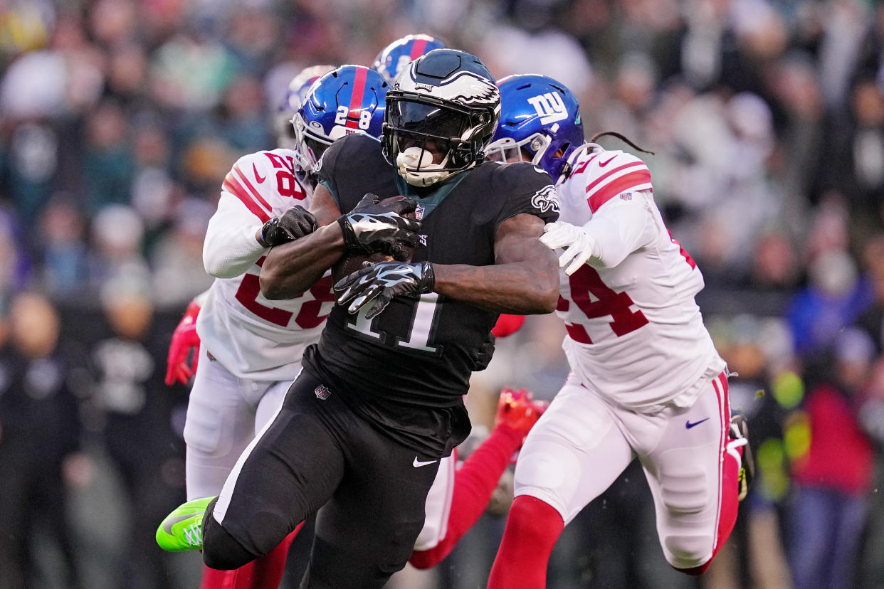PHILADELPHIA, PENNSYLVANIA - JANUARY 08: A.J. Brown #11 of the Philadelphia Eagles runs past Cor'Dale Flott #28 of the New York Giants during the first quarter against the New York Giants at Lincoln Financial Field on January 08, 2023 in Philadelphia, Pennsylvania. (Photo by Mitchell Leff/Getty Images)