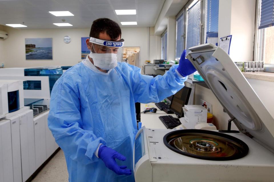 Samples are tested in a machine (AFP via Getty Images)