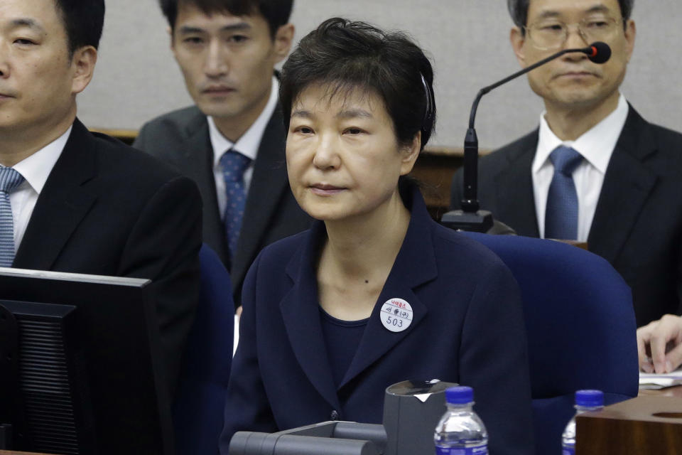 FILE - In this May 23, 2017, file photo, former South Korean President Park Geun-hye, front, sits for her trial at the Seoul Central District Court in Seoul, South Korea. South Korea’s top court upheld 20-year prison term for Park over corruption on Thursday, Jan. 14, 2021. (AP Photo/Ahn Young-joon, Pool, File)