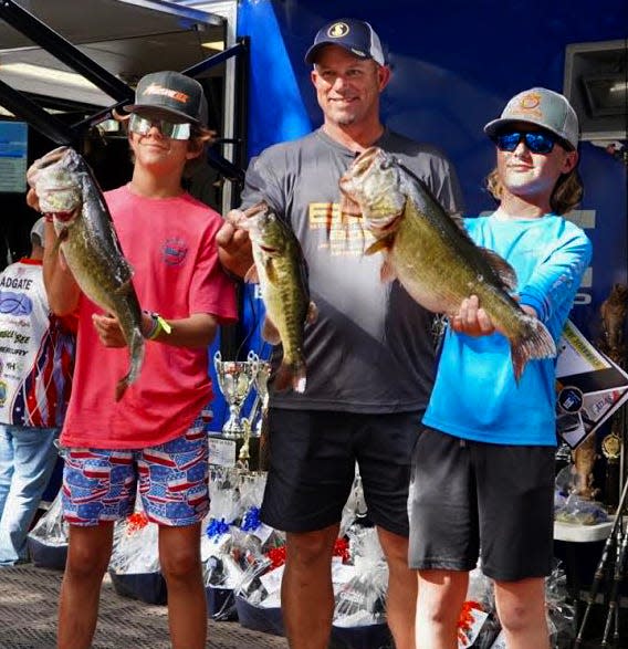 Bobby Lane, center, poses with Juniors Division anglers Gus DeVane and Kayden O'Dell of Tomlin Middle School. The two placed first in the Juniors Division with 16.18 pounds during the 2022 Bobby Lane High School Cup Tournament on Dec. 3, on the Kissimmee Chain.