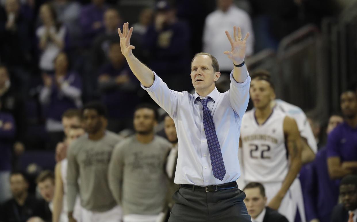 Washington head coach Mike Hopkins gestures to his team during an NCAA college basketball game against Oregon, Saturday, March 3, 2018, in Seattle. Oregon won 72-64. (AP Photo/Ted S. Warren)