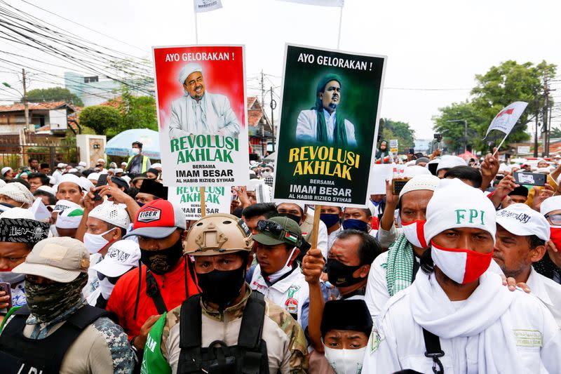 People gather for the homecoming of Rizieq Shihab, the leader of Indonesian Islamic Defenders Front (FPI) who has resided in Saudi Arabia since 2017