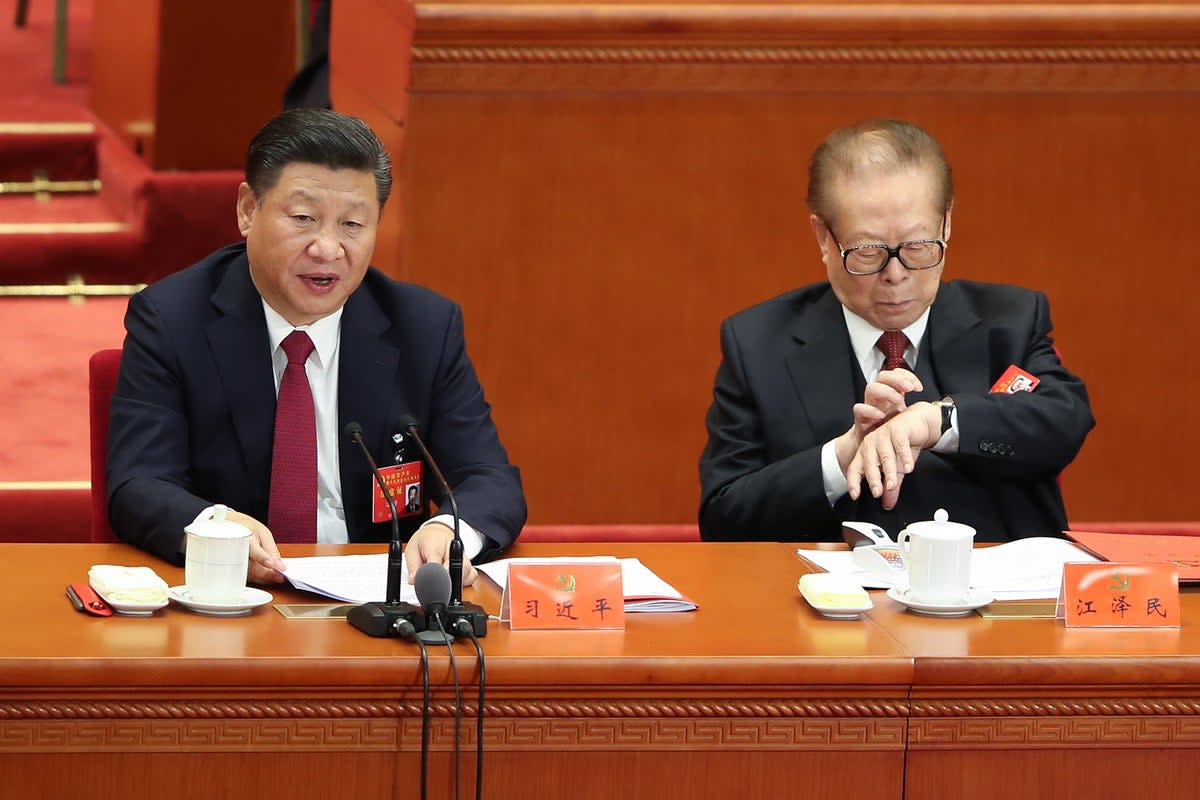 Chinese president Xi Jinping (L) with China’s former president Jiang Zemin (R) attending the closing of the 19th Communist Party Congress at the Great Hall of the People on 24 October 2017 in Beijing, China (Getty Images)