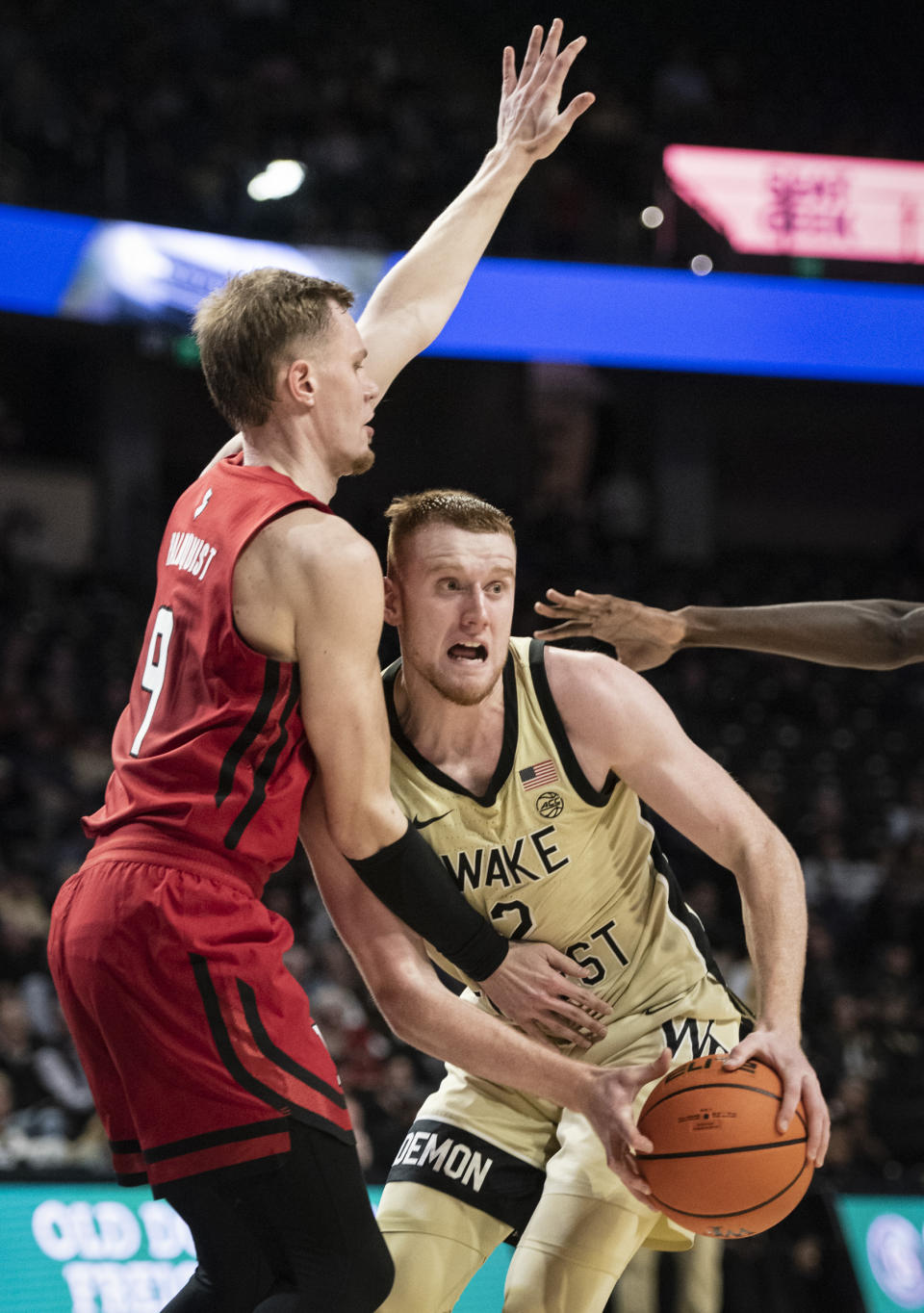 Rutgers' forward Oskar Palmquist (9) applies pressure to Wake Forest guard Cameron Hildreth (2) during the first half of an NCAA college basketball game on Wednesday, Dec. 6, 2023, at Joel Coliseum in Winston-Salem, N.C. (Allison Lee Isley/The Winston-Salem Journal via AP)