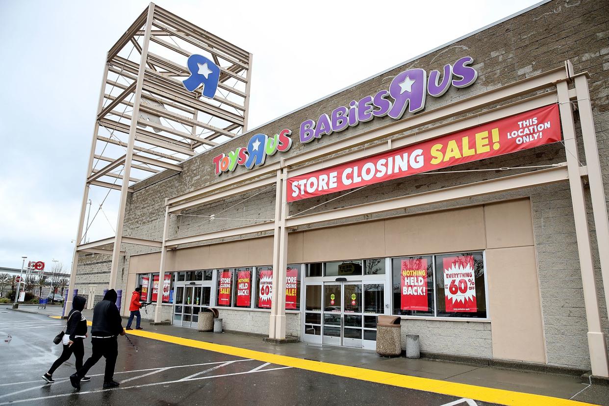 Customers enter a Toys R Us store on March 15, 2018 in Emeryville, California.