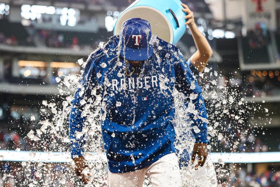 Texas Rangers pitcher Alex Speas (58) gets a ice water shower during his postgame interview after the Rangers defeated the Tampa Bay Rays 5-1 at Globe Life Field in Arlington, Texas on Wednesday, July 19, 2023. Speas, a second-round draft pick in 2016 who was coaching little league baseball last year, made his big league debut and struck out his first three batters in relief. Chris Torres/ctorres@star-telegram.com