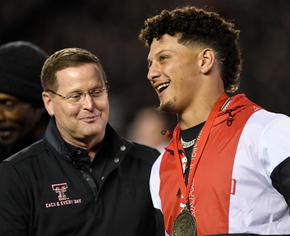 Texas Tech athletics director Kirby Hocutt, left, chats with Patrick Mahomes during Mahomes' induction into the Tech football Ring of Honor. The ceremony took place at the Tech-Baylor football game Oct. 29, 2022, at Jones AT&T Stadium.