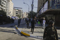 Iraqi security forces patrol near the Chaldean Cathedral of Saint Joseph where Pope Francis is expected to concelebrate mass in, in Baghdad, Iraq, Saturday, March 6, 2021. Earlier today Francis met privately with the country's revered Shiite leader, Grand Ayatollah Ali al-Sistani. (AP Photo/Andrew Medichini)