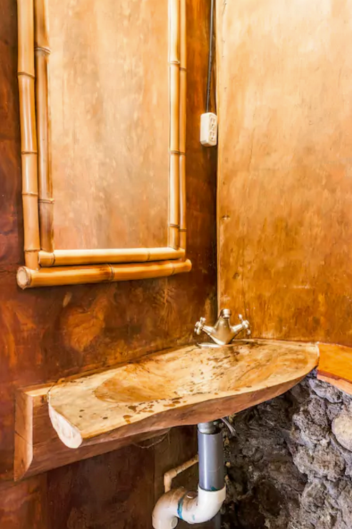 <p>Here’s a look at the wood sink. <br> (Airbnb) </p>