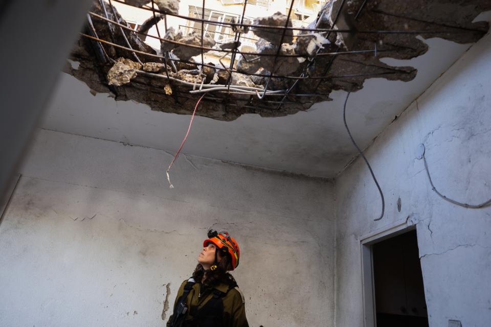 Israeli emergency services inspect damage to a ceiling near Haifa following Hezbollah rocket fire (AFP via Getty Images)