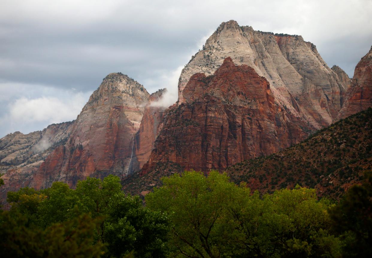 Water flows down rock faces after a rain storm in Zion's National Park on September 15, 2015 in Springdale, Utah. A flash flood in the park killed seven people.