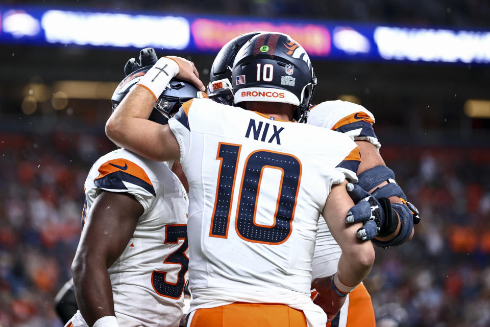 DENVER, COLORADO – AUGUST 18: Bo Nix #10 of the Denver Broncos celebrates with teammates during the first half of a preseason game against the Green Bay Packers at Empower Field at Mile High on August 18, 2024 in Denver, Colorado. (Photo by Tyler Shank/Getty Images)